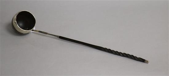 An early 19th century white metal mounted sycamore toddy ladle(a.f.) with baleen handle, 35cm.